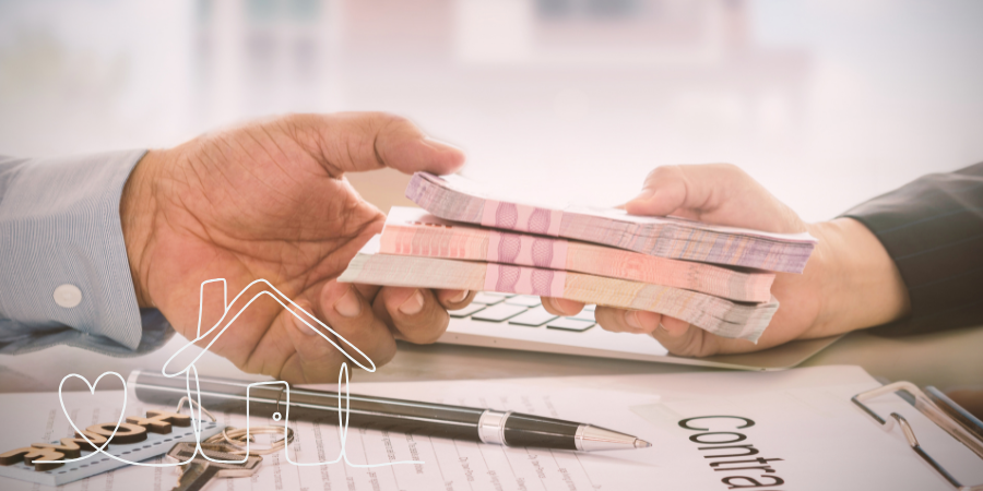 Hands exchanging cash over a signed secured loan contract.